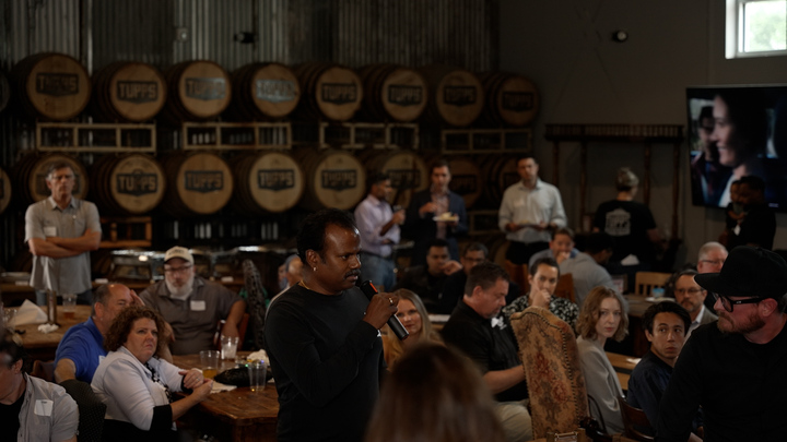 Builder giving a 30-second intro against the TUPPS barrel wall