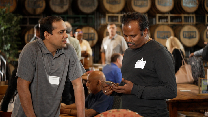 Two builders deep in conversation
